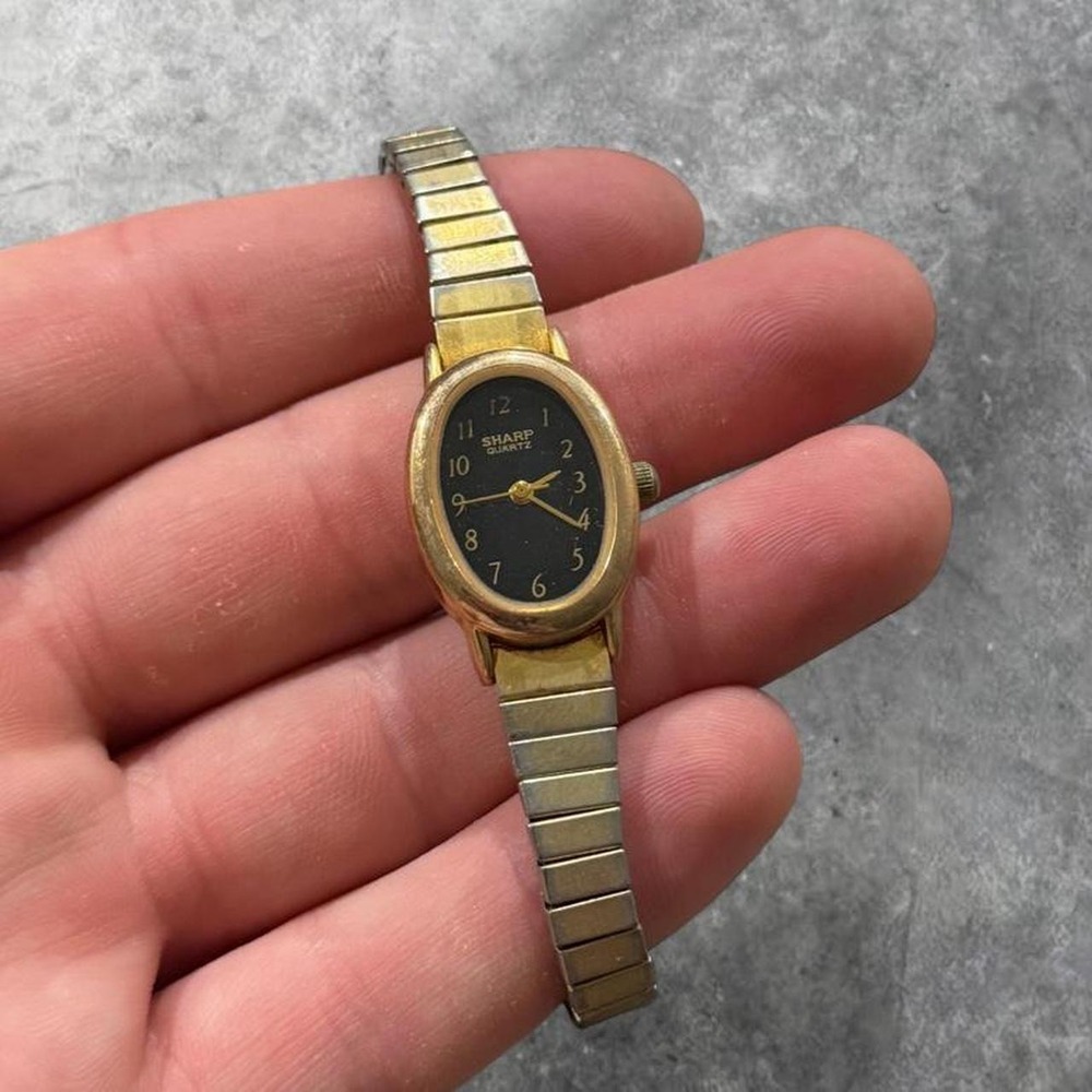Vintage Sharp Quartz Women's Gold-Tone Oval Wristwatch